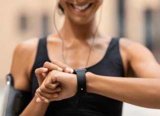 A woman checking her fitness tracker.