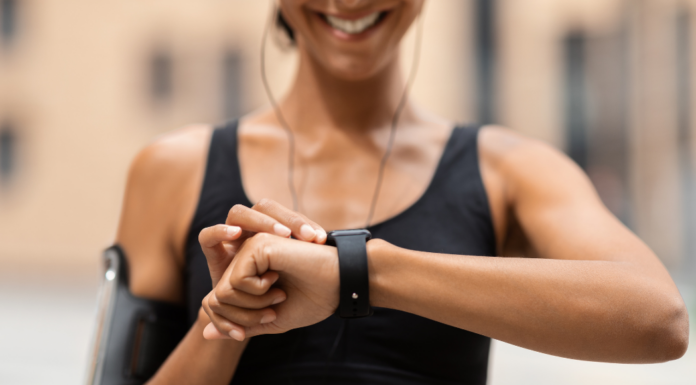 A woman checking her fitness tracker.