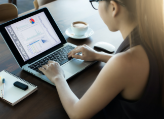A women taking a reader survey on the computer.
