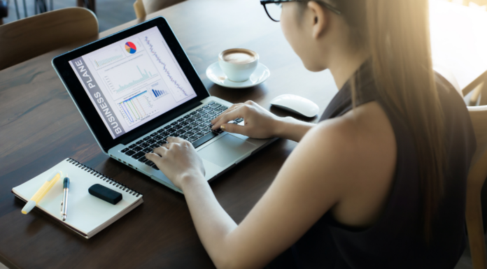 A women taking a reader survey on the computer.