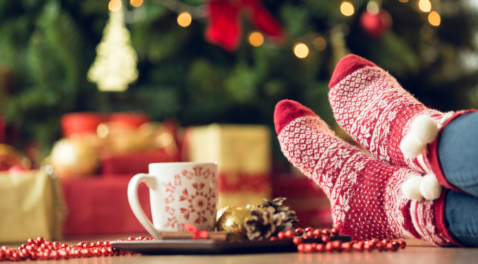 Relaxing with your feet up in front of the Christmas tree.