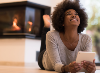 A woman reading the Fairfield County Mom top posts of 2015.