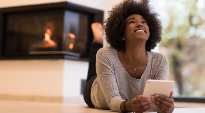 A woman reading the Fairfield County Mom top posts of 2015.