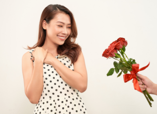 Giving a woman roses.