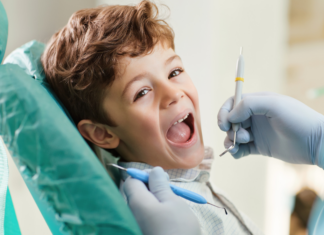 A boy getting a dental exam.