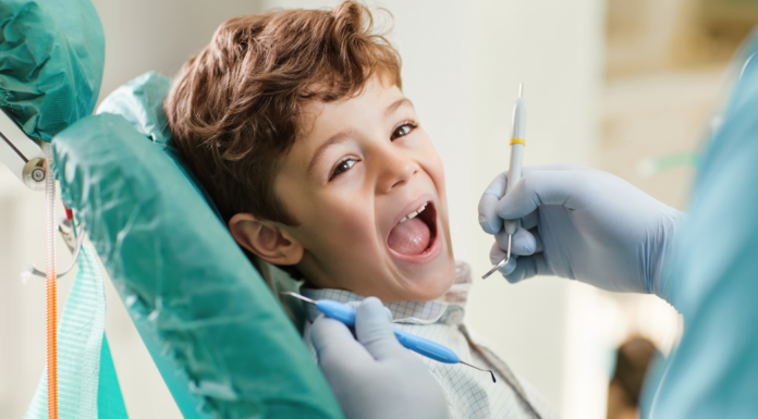 A boy getting a dental exam.
