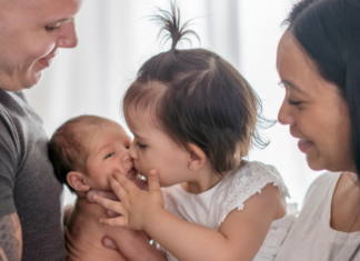 A family welcoming their second baby.