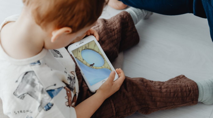 A toddler on a phone.