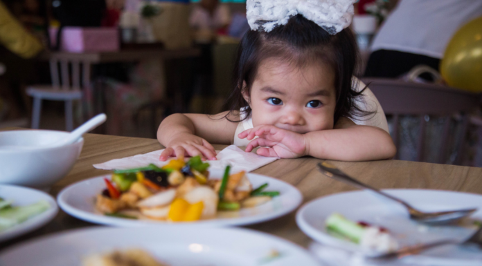 A girl at a family-friendly restaurant.
