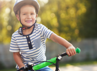 A kid riding a bike.
