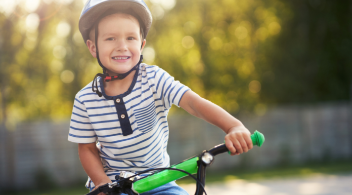 A kid riding a bike.