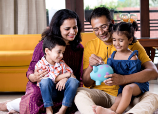 A family putting money in a piggy bank.