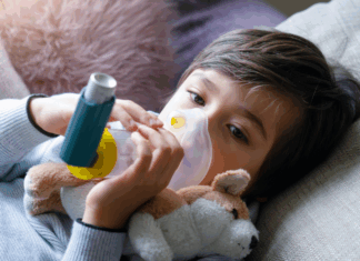 Just Breathe – Living with Childhood Asthma A child with a nebulizer.