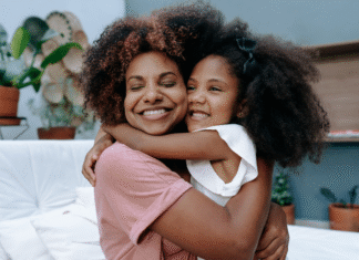 The First Day: A Mother’s Reflection A mother and daughter hugging.