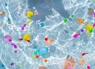 Water balloons popped in a pool.
