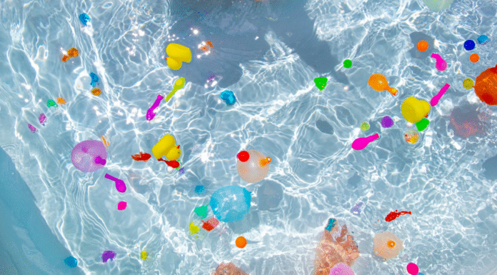 Water balloons popped in a pool.