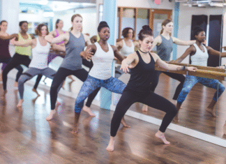 Women at a barre class.