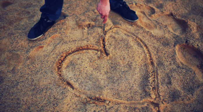 A heart drawn in the sand.