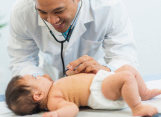 A pediatrician examining a baby.
