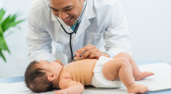 A pediatrician examining a baby.