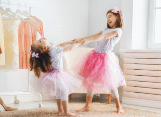 Two girls dressing up as princesses.