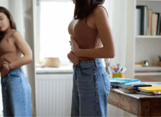 A woman looking in the mirror.