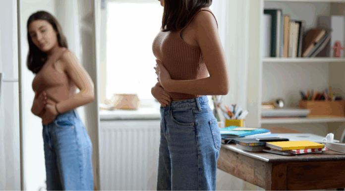 A woman looking in the mirror.