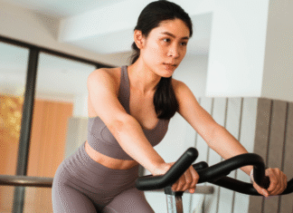 Woman on a stationary bike.