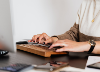 A woman working on the computer.