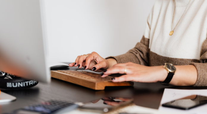 A woman working on the computer.