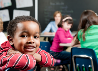 Embracing My First Grader Growing Up First graders in a classroom.