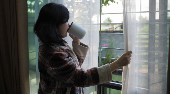 Drinking coffee during quiet time looking out the window.