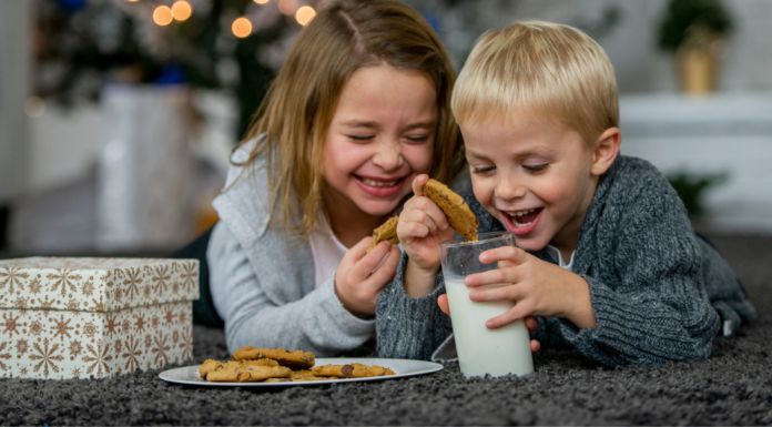 Kids eating cookies and milk.