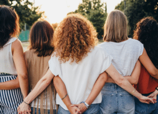 How to Make a Lot of Friends Fast Woman holding each other.