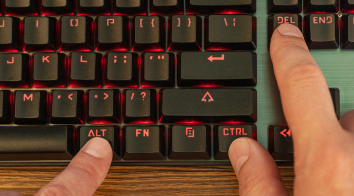 Pressing control, alt, delete on the keyboard.