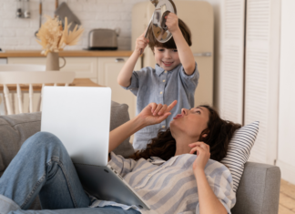5 Things My Kids Hate and I Love A boy banging above his mom's head while she tries to work on her computer.