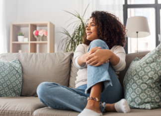 A woman sitting on the couch.