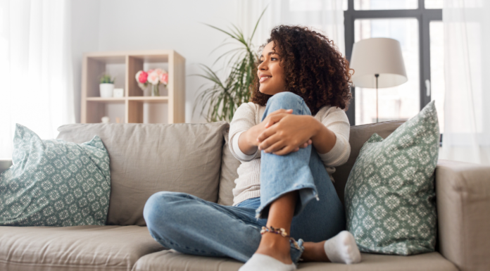 A woman sitting on the couch.