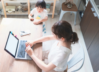 Why Working Moms Don’t Have an Ugly Secret A working mom on her computer.