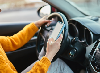 A woman on her cell phone while driving.