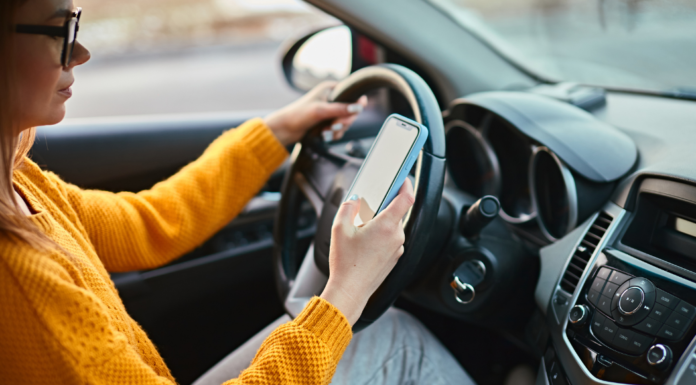 A woman on her cell phone while driving.