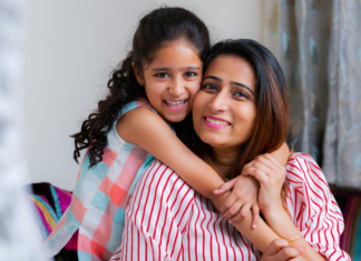 A daughter hugging her mom.