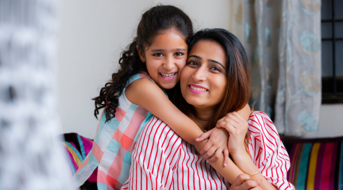 A daughter hugging her mom.