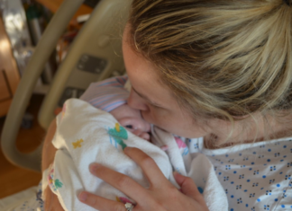 Meet Maria: Mom-Me, How I Came to Be Maria- F holding her firstborn baby.