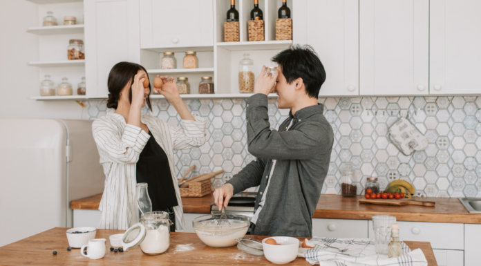 A couple in the kitchen.