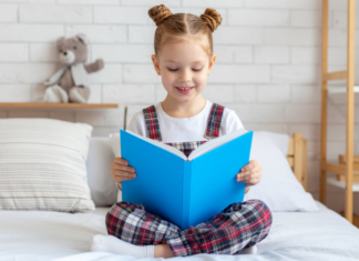 Fun With Dr. Seuss A girl reading a book.