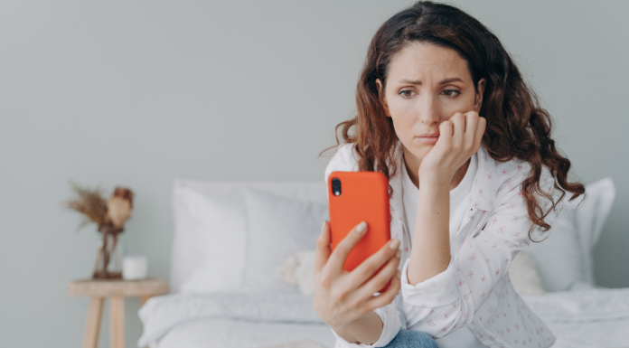 A woman looking at her phone.