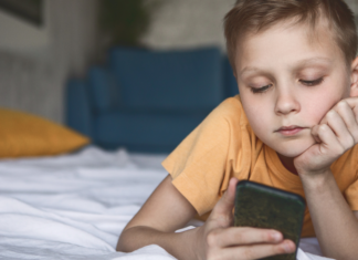 Why My 8-YearOld Does Not Need Social Media An 8-year-old with a phone.