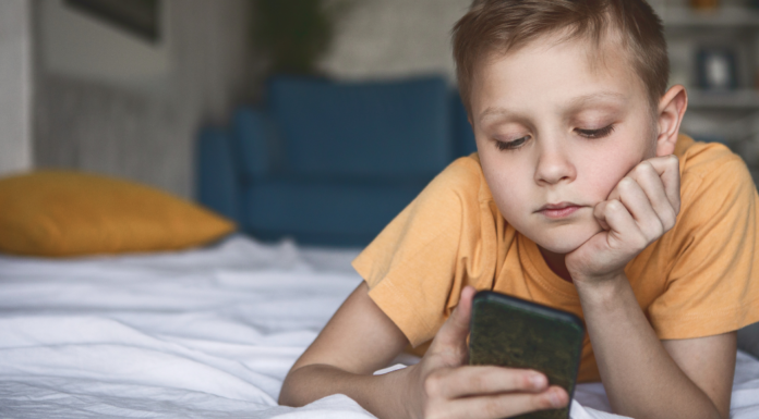 An 8-year-old with a phone.