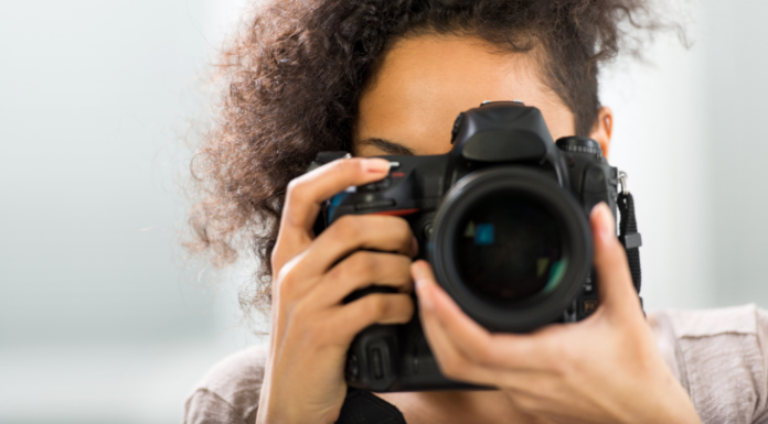 A woman holding a camera.